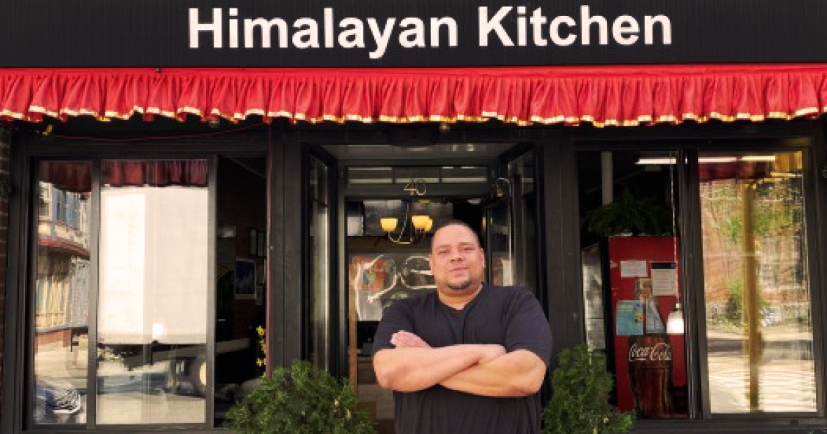 Jeremy Lockett in front of Himalayan Kitchen Restaurant