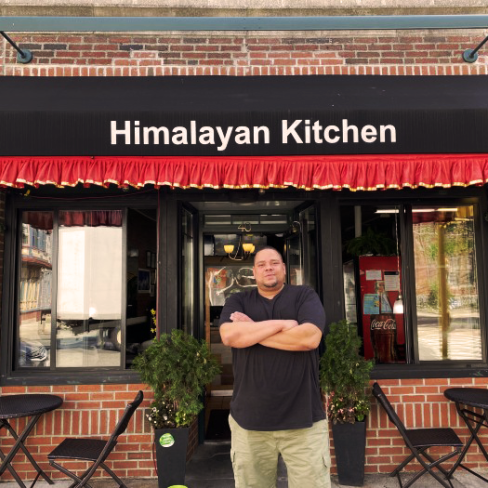 Jeremy Lockett in front of Himalayan Kitchen Restaurant